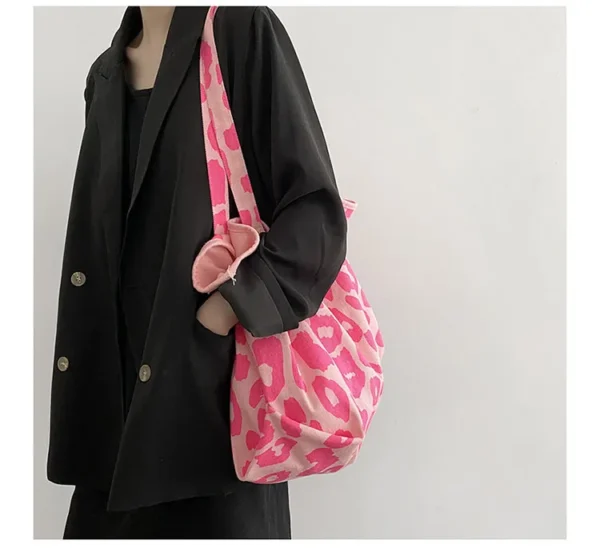 Fashion meets function in this essential pink reusable bag.