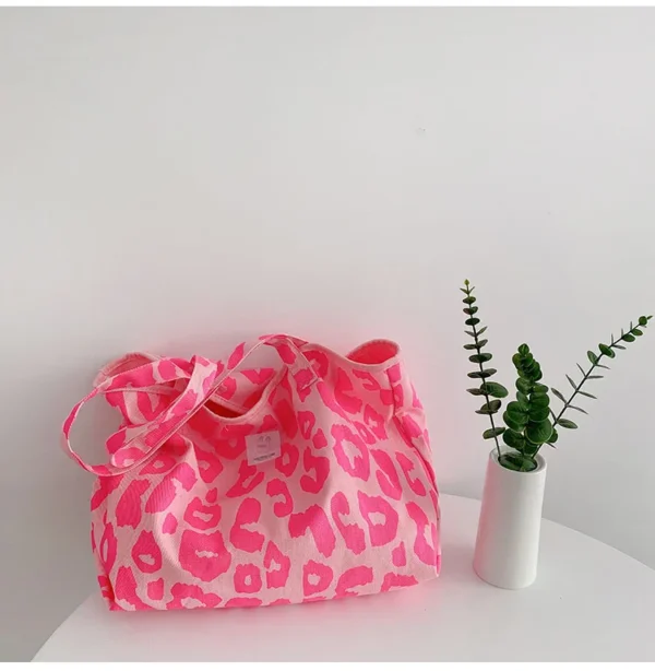 Brighten your day and reduce waste with our pink reusable bag.