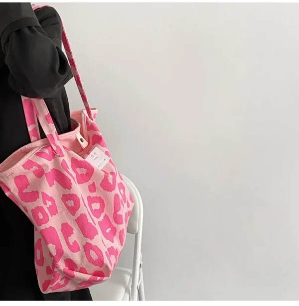 Carry your essentials in style with a pink reusable bag.