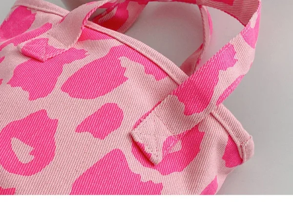 oin the movement towards greener living with a pink reusable bag.