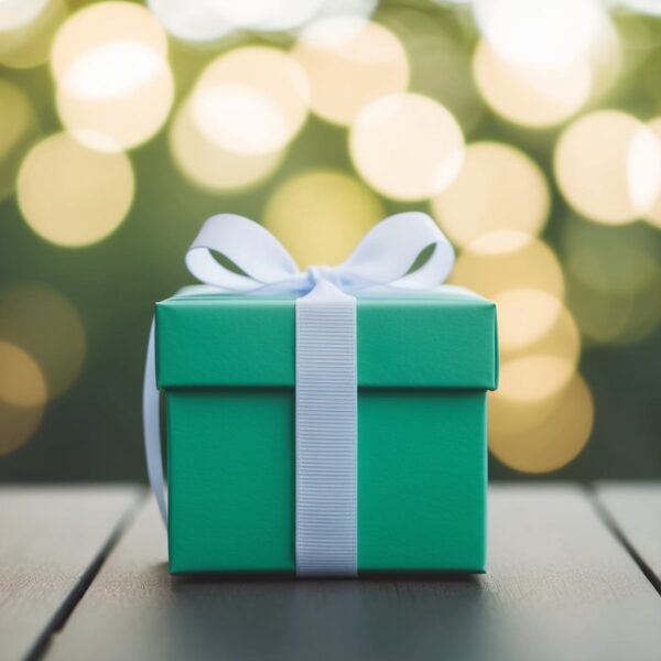 A single, solid-colored gift box with a simple, unadorned ribbon tied in a neat bow. the perfect gift wrap ideas